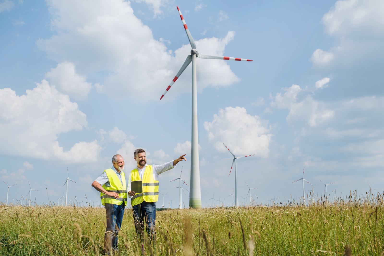 Engineers making notes at a wind farm