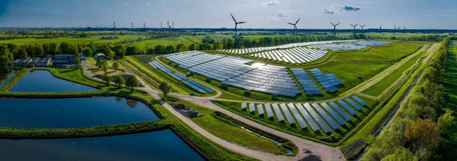 Photovoltaic power plant and wind turbine farm situated by landfill